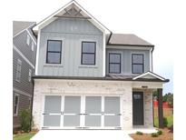 Charming two-story home with a brick-and-siding facade and integrated garage at 1058 Crest Mill Dr, Marietta, GA 30008
