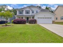 Charming two-story home with a well-manicured lawn, landscaping, and a two-car garage at 2951 Edgewater St, South Fulton, GA 30331