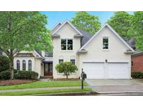 Charming two-story home featuring a manicured lawn, double garage, and classic architectural details at 3714 Westbrooke Ne Cir, Brookhaven, GA 30319
