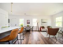 Open-concept living room features modern finishes, hardwood floors, and bright natural light at 1678 Capistrana Pl, Decatur, GA 30032