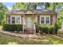 Charming single-story home featuring a cozy front porch and well-maintained landscaping at 3146 Alston Dr, Decatur, GA 30032
