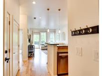 Inviting condo hallway leads to a bright living area with wood floors and modern fixtures at 1430 Dresden Ne Dr # 225, Atlanta, GA 30319