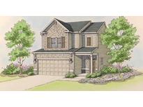 Charming two-story home with a neutral color palette, a two-car garage, and a well-manicured lawn at 2673 Jordan Ln, Lithia Springs, GA 30122