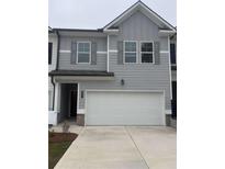 Charming two-story home featuring a spacious two-car garage and gray color scheme at 6423 Rosetta Drive, Unit 66 # 66, South Fulton, GA 30331