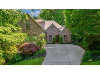 Charming brick home with mature trees and a long, inviting driveway at 1255 Beech Haven Ne Rd, Atlanta, GA 30324