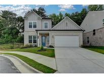 Charming two-story home featuring a manicured lawn and a two-car garage at 2505 Whistler Way Ne, Lawrenceville, GA 30043