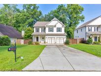 Charming two-story home with a well-manicured lawn and a two-car garage at 4230 Old Cherokee St, Acworth, GA 30101
