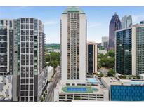 High-rise building featuring a rooftop pool and tennis court, perfect for luxury living with stunning city views at 1280 W Peachtree Nw St # 1013, Atlanta, GA 30309