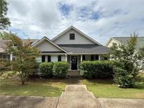 Charming single-Gathering home featuring manicured landscaping and a welcoming front porch at 363 Chadwick, Stockbridge, GA 30281