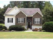 Charming single-Gathering home with stone and siding, featuring a well-manicured lawn and inviting front entrance at 100 Sydney Smt, Villa Rica, GA 30180