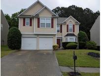 Charming two-story home with red shutters, a two-car garage, and a well-maintained lawn at 3514 Ethridge Nw Ln, Kennesaw, GA 30144