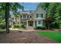 Charming stone and shingle home featuring a landscaped front yard and inviting entrance at 118 Whitestone Dr, Mcdonough, GA 30253