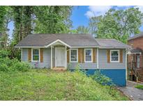 Charming single-story home featuring rustic shutters and a covered entryway at 1285 North Nw Ave, Atlanta, GA 30318