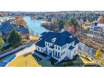 Stunning waterfront home with meticulous landscaping and a private backyard at 2837 Darlington Run, Duluth, GA 30097