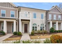 Charming townhouse with a welcoming entrance and a small balcony on the second story at 891 Proctor Oaks Nw St, Atlanta, GA 30318