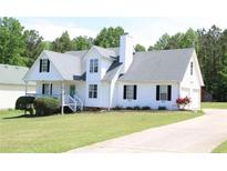 Charming two-story home with a well-manicured lawn and inviting front porch at 287 Diamond Ct, Carrollton, GA 30116