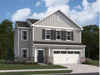Charming two-story home featuring gray siding, black shutters, and a two-car garage at 7797 Sudbury Cir, Covington, GA 30014