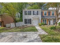 Charming two-story townhome with a well-manicured front yard and inviting entrance at 3571 Kennesaw Station Nw Dr, Kennesaw, GA 30144