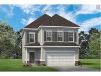 Charming two-story home featuring symmetrical window designs and a welcoming attached two-car garage at 295 Cranston Dr, Canton, GA 30114
