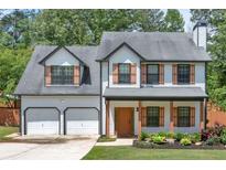 Charming two-story home with a two-car garage and inviting front porch at 40 Polo Xing, Hiram, GA 30141