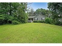 Charming single-Gathering home with a well-manicured lawn and mature trees at 251 Lambeth Dr, Hiram, GA 30141