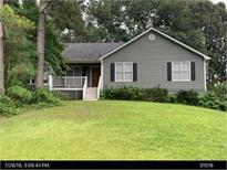Charming single-story home with gray siding, black shutters, and a well-manicured front lawn at 251 Lambeth Dr, Hiram, GA 30141