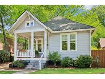 Charming bungalow with a covered front porch, stone steps, and landscaped yard at 34 Clifton Se St, Atlanta, GA 30317