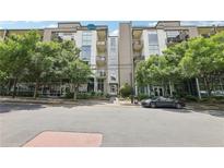 Modern condo building exterior with trees, street view, and covered parking at 3400 Malone Dr # 303, Atlanta, GA 30341