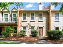 Traditional multi-level home with landscaped front yard and beige siding at 4108 Gray Birch Ln, Duluth, GA 30096
