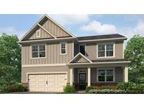 Charming two-story home featuring a neutral color palette, inviting front porch, and attached two-car garage at 2709 Montie Ct, Lithia Springs, GA 30122