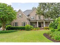 Charming brick home with a manicured lawn and inviting front porch at 2870 Redding Ne Rd, Atlanta, GA 30319