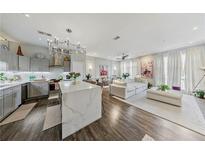 Bright and airy living room featuring a modern kitchen and elegant decor, creating a welcoming atmosphere at 560 Dutch Valley Ne Rd # 2207, Atlanta, GA 30324