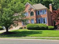 Charming two-story brick home with a well-manicured lawn and lovely blue shutters at 1270 Heritage Lakes Dr, Mableton, GA 30126