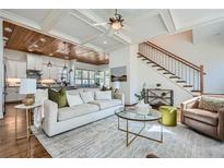 Open-concept living room with a modern sofa, staircase, and stylish decor at 2987 Jefferson St, Atlanta, GA 30341