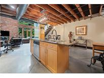 Modern kitchen island with granite countertops and stainless steel appliances at 319 Atlanta Se St # 315, Marietta, GA 30060