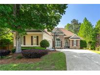 Charming single Gathering home with a well-manicured lawn and stone and siding exterior at 931 Windsor Creek Dr, Grayson, GA 30017
