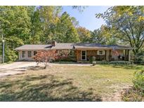 Charming single-story home with covered front porch and well-maintained lawn at 255 Shipp Cir, Hiram, GA 30141