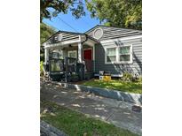 Charming bungalow-style home with a welcoming front porch and well-maintained landscaping at 1081 Ashby Grv, Atlanta, GA 30314