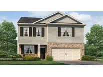 Charming two-story home with stone accents, attached two car garage and a manicured front yard at 3941 Fairhaven Rd, Lithia Springs, GA 30122