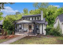 Charming renovated cottage with a welcoming front porch and craftsman details at 1227 Epworth Sw St, Atlanta, GA 30310