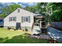Charming single-Gathering home featuring a covered front porch and well-maintained lawn at 1149 Avondale Se Ave, Atlanta, GA 30312