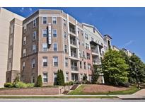 Modern multi-story apartment complex with brick facade, balconies, and landscaped grounds at 390 17Th Nw St # 4055, Atlanta, GA 30363