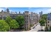 Apartment complex in an urban setting features mature trees and a view of the city skyline at 390 17Th Nw St # 6036, Atlanta, GA 30363