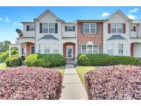 Inviting townhome featuring a well-manicured lawn and appealing architectural details at 7120 Oakley Ct, Union City, GA 30291