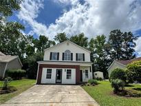 Charming two-story home with a well-maintained front yard and classic curb appeal at 2711 Teal Landing Dr, Morrow, GA 30260