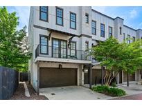 Charming three-story townhome featuring a private balcony and a convenient one-car garage at 743 Taylor Ne Ct, Atlanta, GA 30324