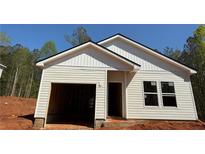 New construction home featuring light siding, an attached garage, and a classic roofline at 451 Courthouse Park Dr, Temple, GA 30179