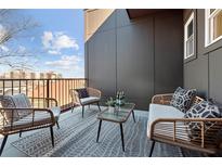 Cozy outdoor patio area with stylish furniture and a decorative rug at 456 Parkway Ne Dr # 10, Atlanta, GA 30308