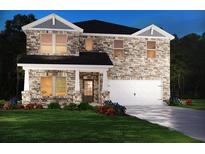 Stunning two-story stone home with a two-car garage, manicured lawn, and inviting front porch at 7757 Halifax Way, Fairburn, GA 30213