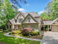 Charming two-story home with neutral paint and landscaped yard at 8170 Hurakan Creek Xing, Cumming, GA 30028